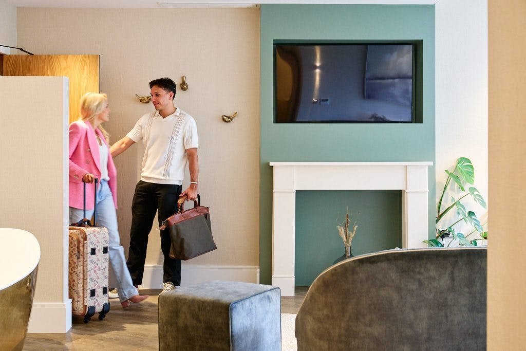 A couple checking in to a room at Fairlawns Hotel and Spa
